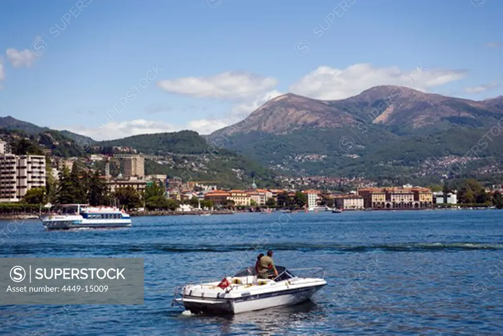 Motorboat and excursion boat on Lake Lugano, Lugano, Ticino, Switzerland