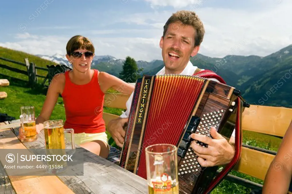 Man playing accordion, Bichlalm (1731 m), Grossarl Valley, Salzburg, Austria