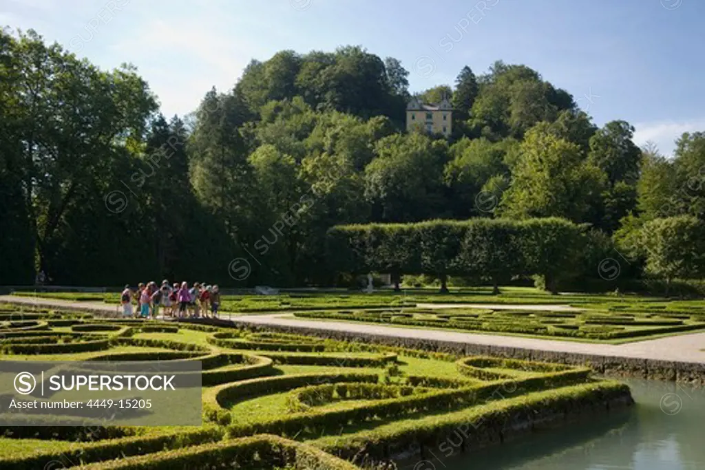 Group of children visiting water parterre, Month Palace in background, Hellbrunn Palace, oldest baroque palace site north of the Alps, Salzburg, Salzburg, Austria