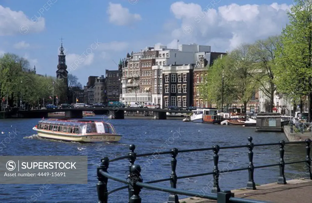 Excursion boat on Binnenamstel in front of Munttoren, Amsterdam, Netherlands, Europe