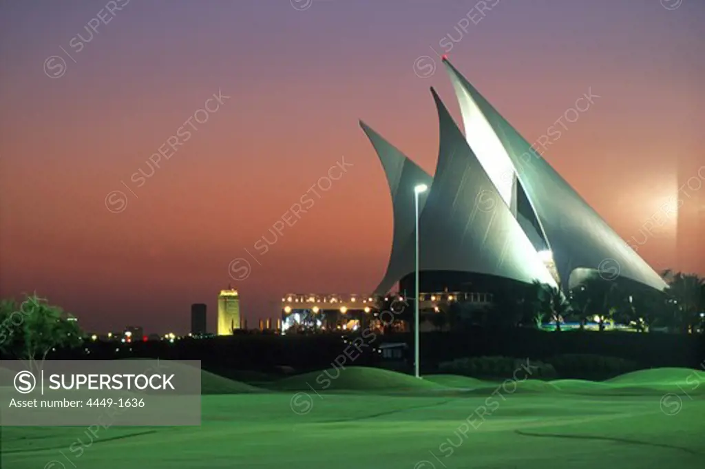 The illuminated clubhouse of the Dubai Creek Golf Club in the evening, Dubai, United Arab Emirates, Asia