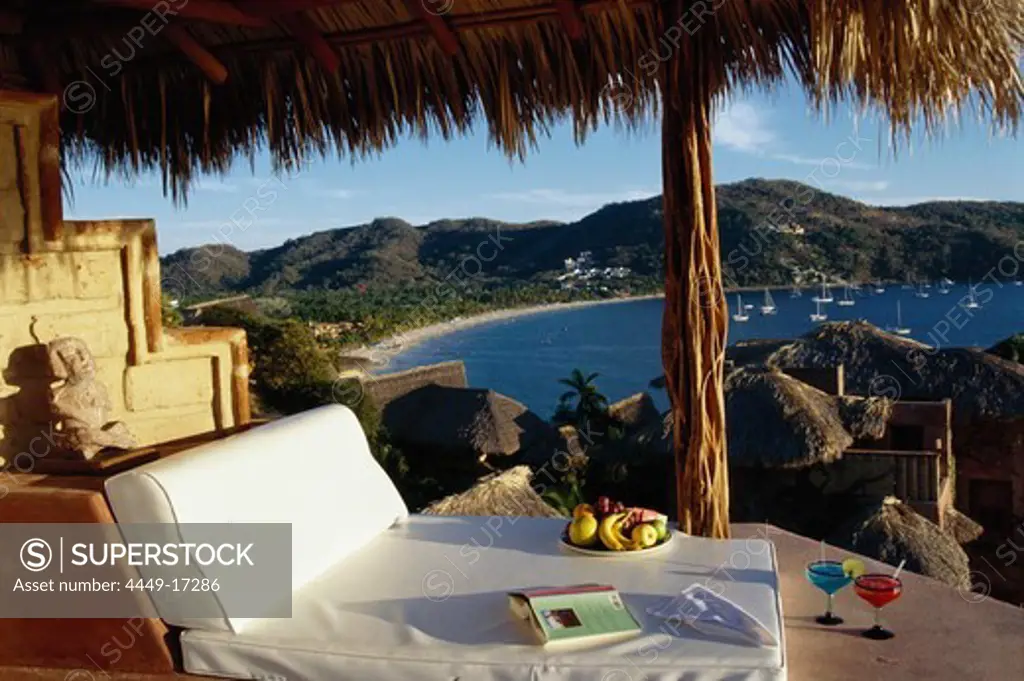 Sun lounger with cocktails and fresh fruit, small luxury hotel, La Casa que canta Zihuatanejo, Guerrero, Mexico, America