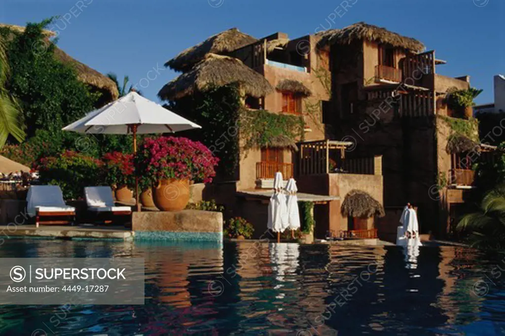 Small Luxury Hotel with reflection in water, La Casa que canta Zihuatanejo, Guerrero, Mexico, America