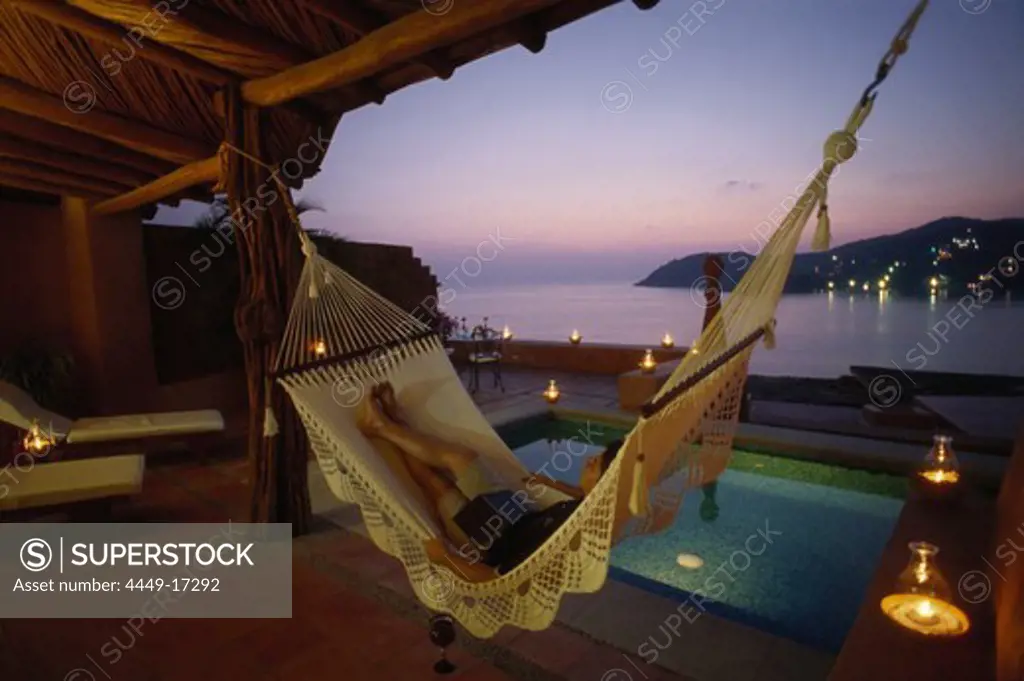 Man relaxing in a hammock, Suite, Small Luxury Hotel, La Casa que canta Zihuatanejo, Guerrero, Mexico, America