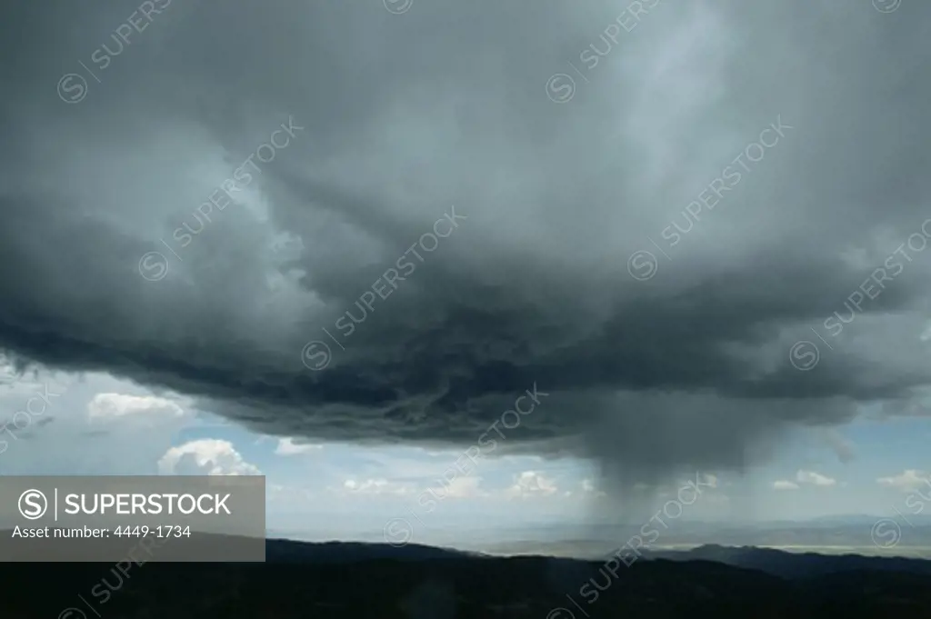 Cloudburst, dark clouds over the lowlands, Nevada, USA