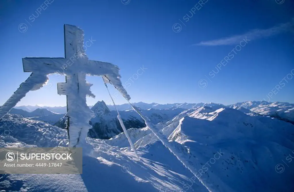 Cross with rime ice on summit of Brechhorn, Kitzbuehel range, Tyrol, Austria