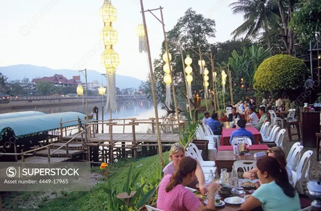 People at the restaurant Riverside on the Mae Nam Ping river in the evening, Chiang Mai, Thailand, Asia