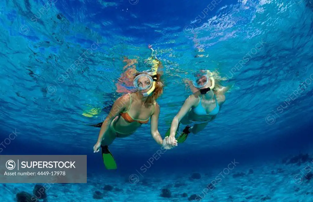 Two snorkeling girls, Indonesia, Bali, Indian Ocean
