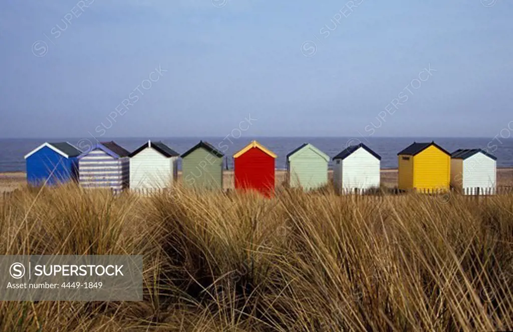 A line of colourful beach huts, Southwold, East Anglia, England