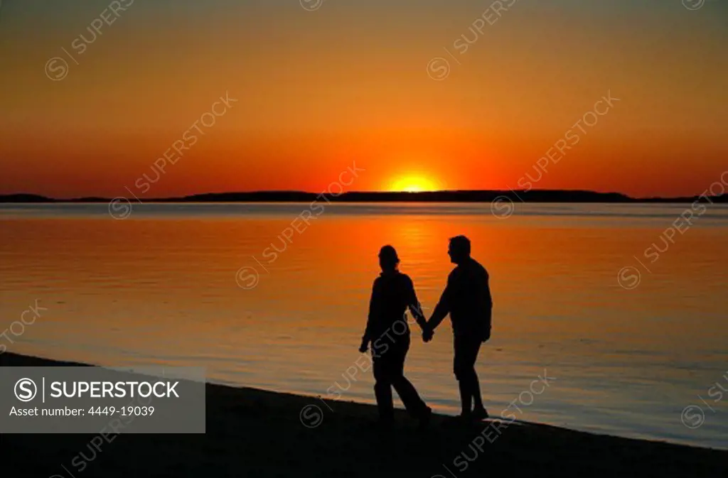 A couple enjoying the sunset, Wellfleet Harbor, Cape Cod, Massachusetts, USA