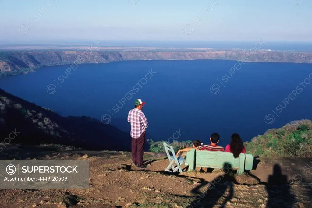 A family enjoying the view from Mirador de Catarina over Laguna de Apoyo, Lake Nicaragua, Nicaragua, Central America