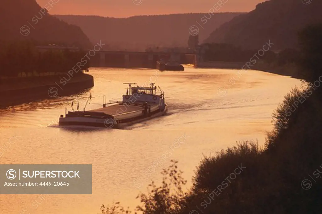 Freighter on the Rhine-Main-Danube Canal at sunset, Lower Bavaria, Germany