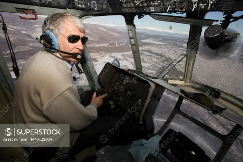 A helicopter pilot in the cockpit of a Russian MI-8 helicopter, Kamtchatka, Sibiria, Russia