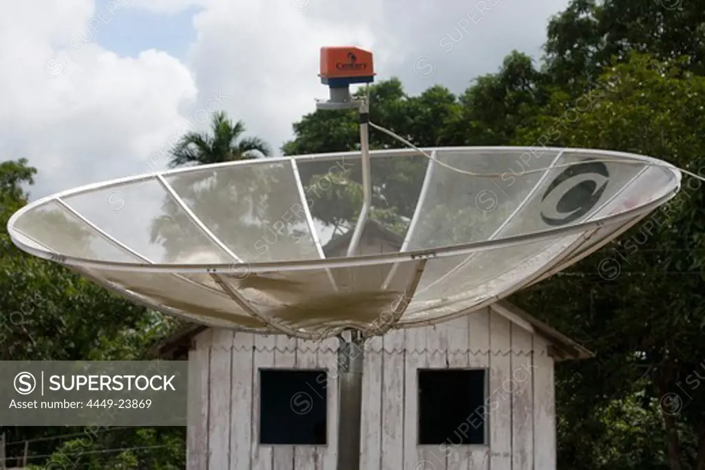 Satellite dsh in a village in the Amazon Rainforest, Boca da Valeria, Amazonas, Brazil, South America