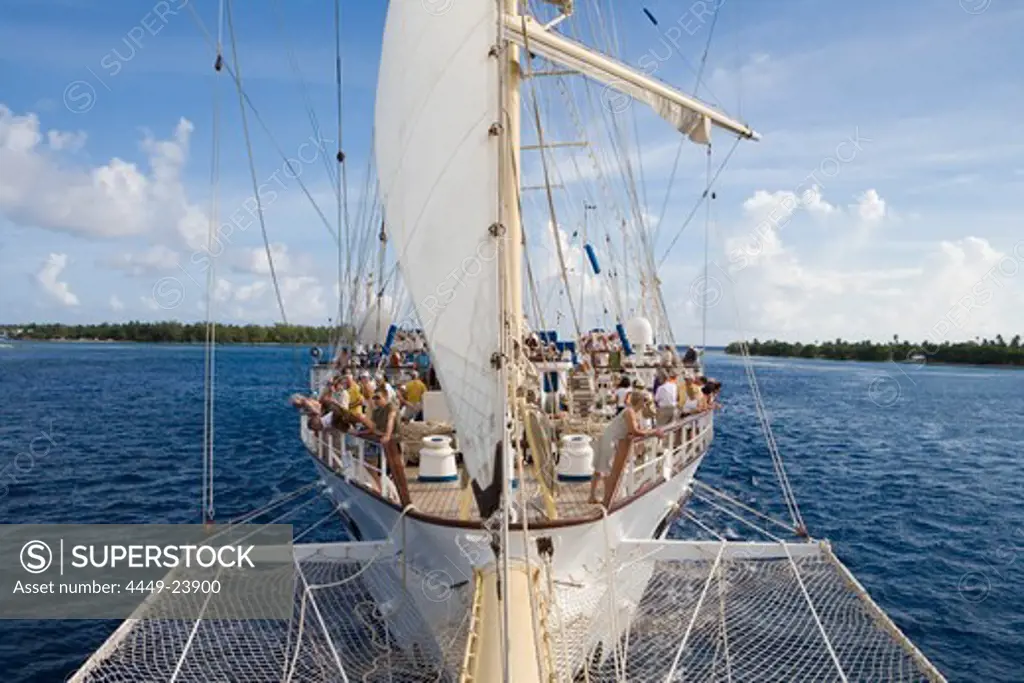 Sailing Cruiseship Star Flyer (Star Clippers Cruises) sails through Avatoru Pass into Rangiroa Atoll, Rangiroa, The Tuamotus, French Polynesia