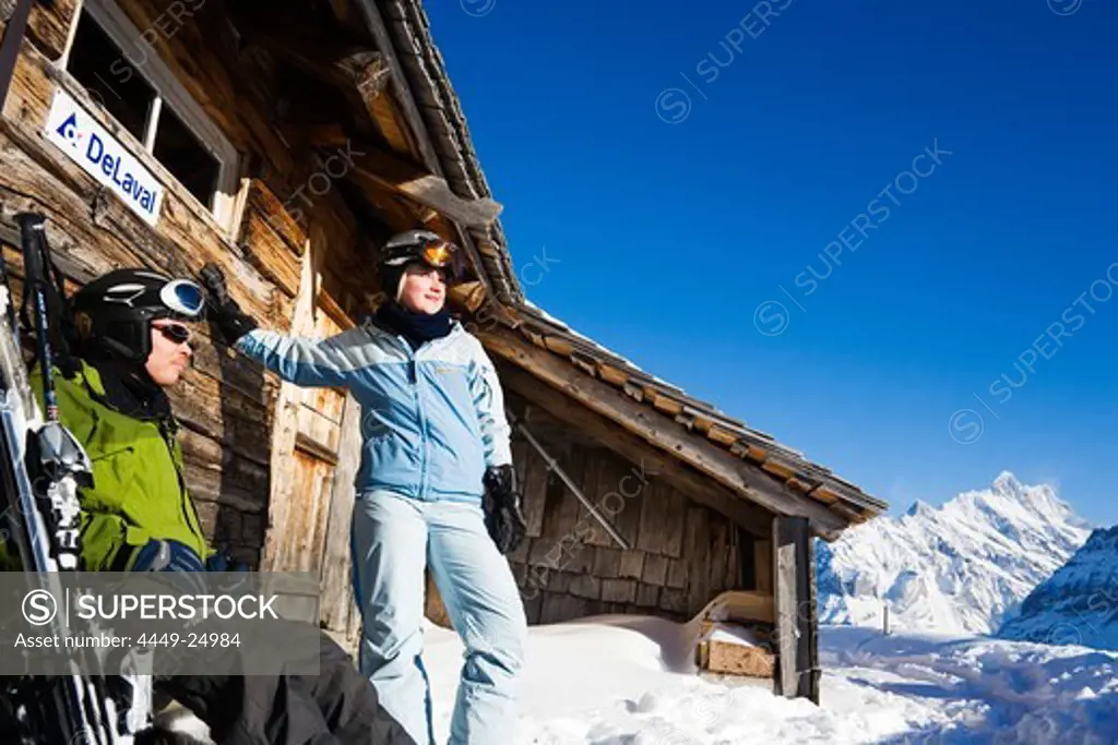 Back country skiers resting at alpine hut, Maennlichen, Grindelwald, Bernese Oberland, Canton of Bern, Switzerland