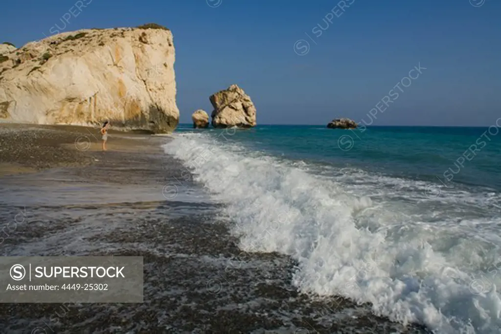 Woman near Petra tou Romiou, Rock of Aphrodite, Aphrodite's birthplace, Symbol, the Rock from which Aphrodite mythically arose from the sea, Limassol, South Cyprus, Cyprus