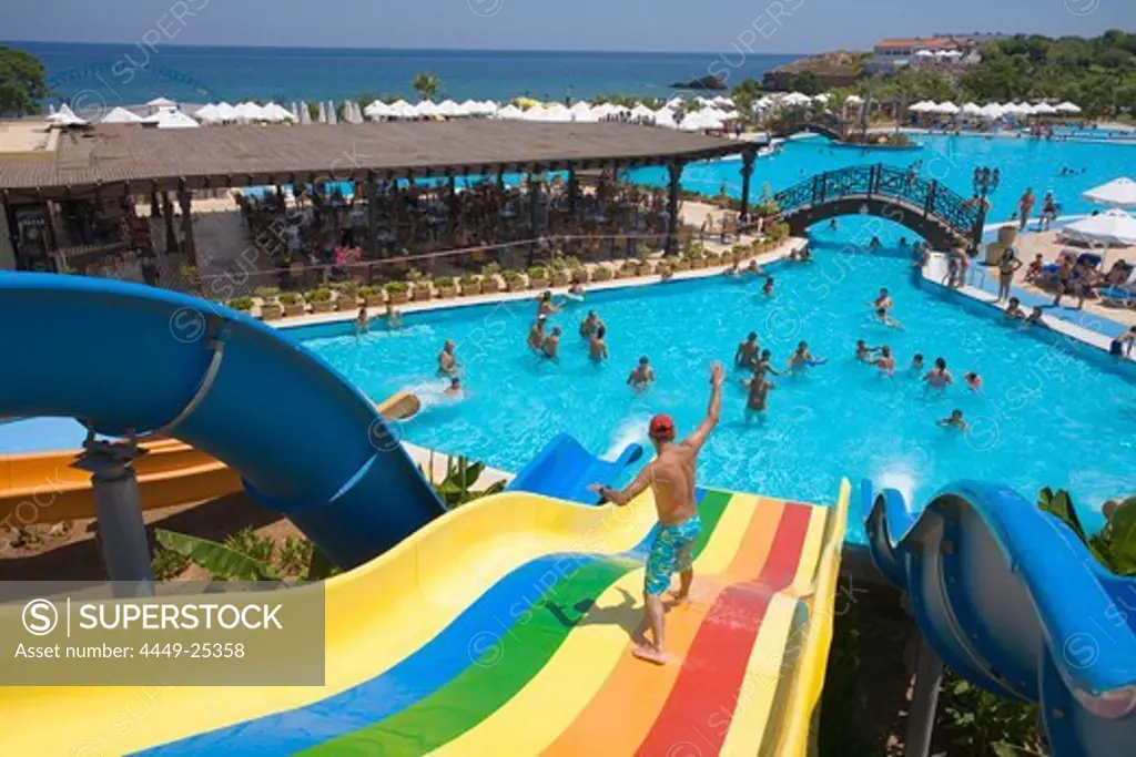 Young man on a water slide, water park, Acapulco Beach Club and Resort Hotel, 10km east of Kyrenia, Girne, Keryneia, Cyprus