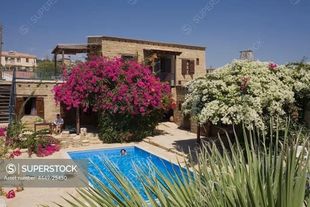 A woman swimming in the water, Traditional guesthouse and pool, Cyprus Villages Traditional Houses Ltd., Agrotourism, Tochni, near Larnaka, Cyprus