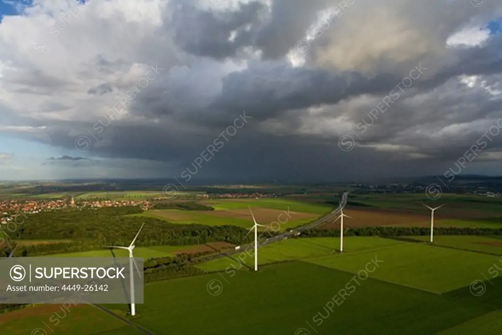 aerial view of wind turbines in the landscape, autobahn, dark clouds, near Hanover, Lower Saxony, northern Germany
