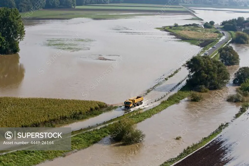 aerial view of truck driving through floodwaters, farmland, Leine River in the Hanover region, Lower Saxony, northern Germany