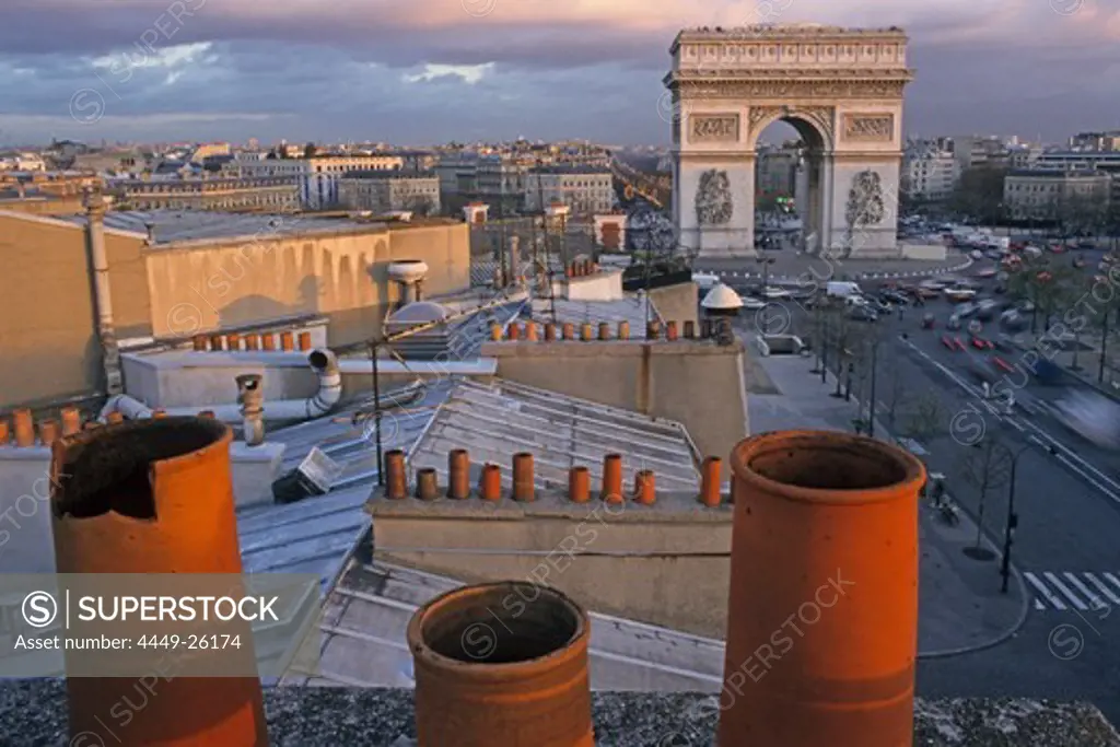 View of roofs and Arch of Triumph in the evening, Place de l'Etoile, Paris, France, Europe