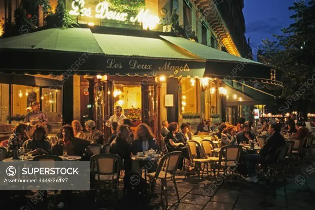 Café in the evening light, Les Deux Magots, waiter serving drinks, Boulevard Saint Germain, 6e Arrondissement Paris, France