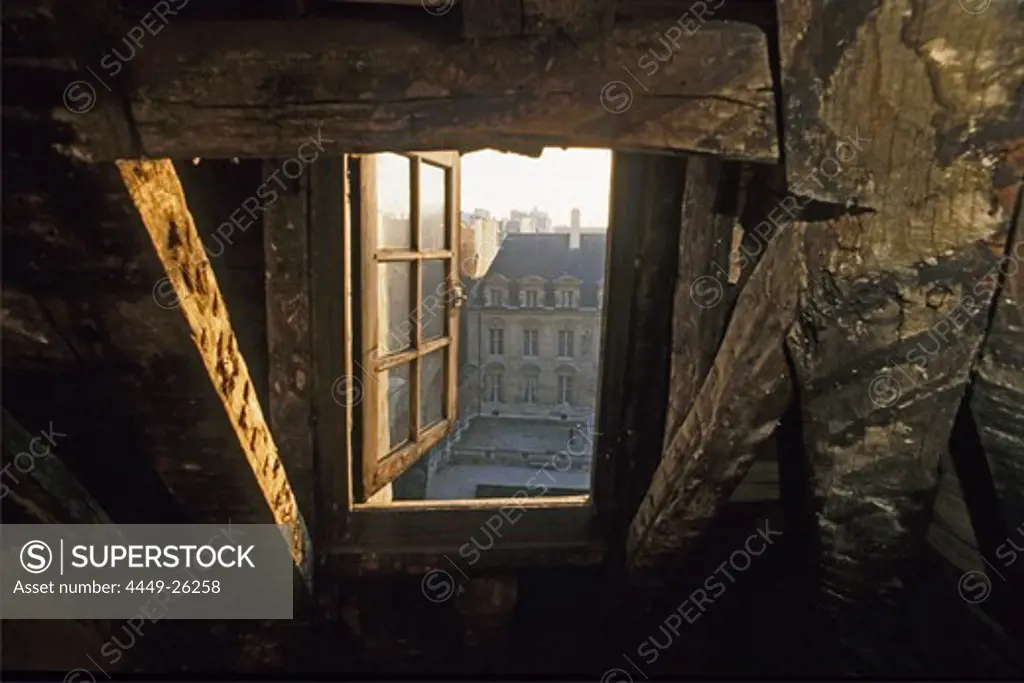 Attic window under the roof, Places Vosges, Paris, France