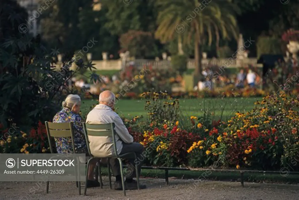 Elderly couple looking at the flowers in the Jardin du Luxembourg, largest public park in Paris, 6e Arrondissement, Paris, France