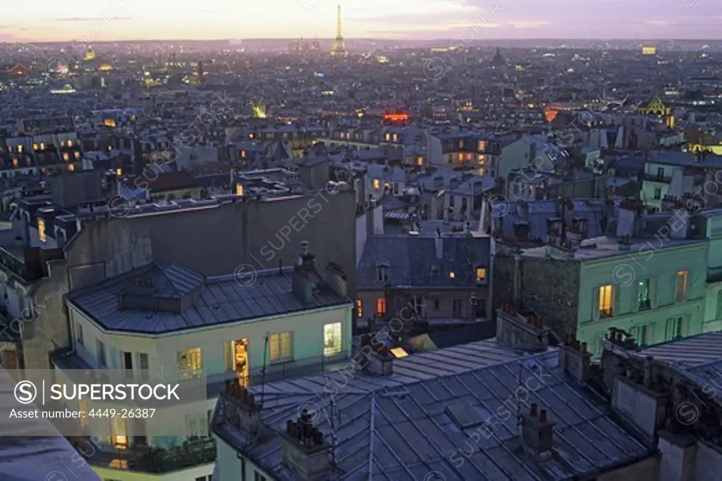 View over roofs of Paris onto the Eiffel Tower in the evening, Montmartre, Paris, France, Europe