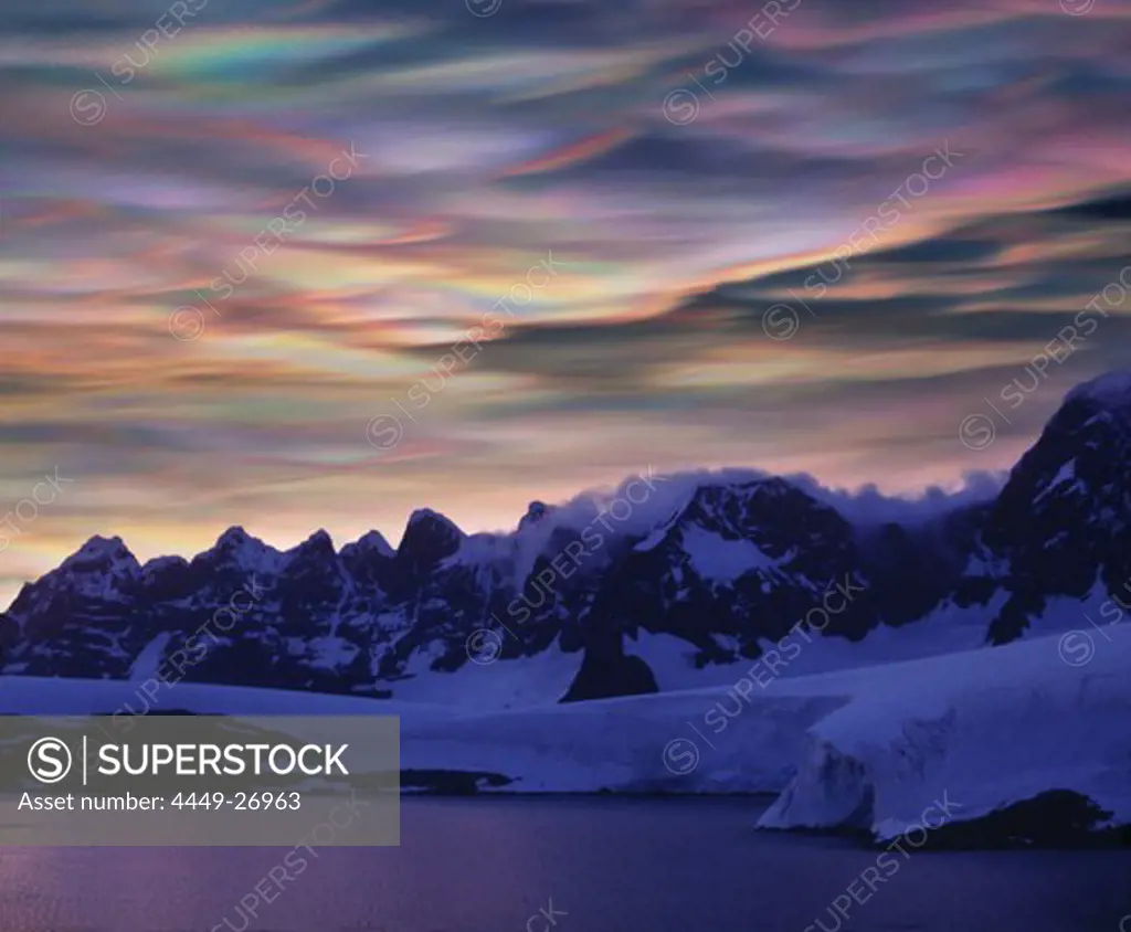 Mother of pearl clouds, nacreous clouds over snow covered mountains, Antarctic Peninsula, Antarctica