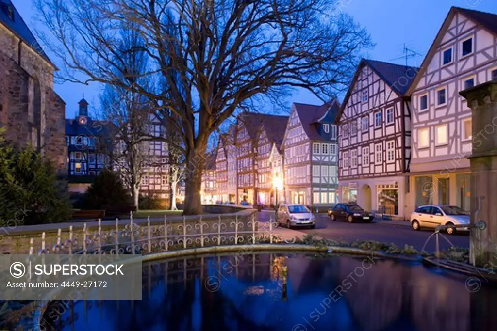 Fountain and half-timbered houses at Melsungen in the evening, Melsungen, Hesse, Germany, Europe