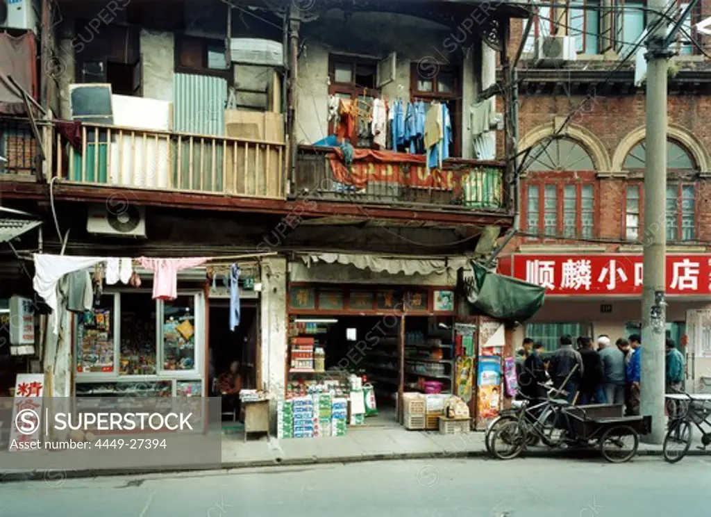 Men playing Mahjong, Urban development, Longtang houses and small shops, Emei Lu, Shanghai, China