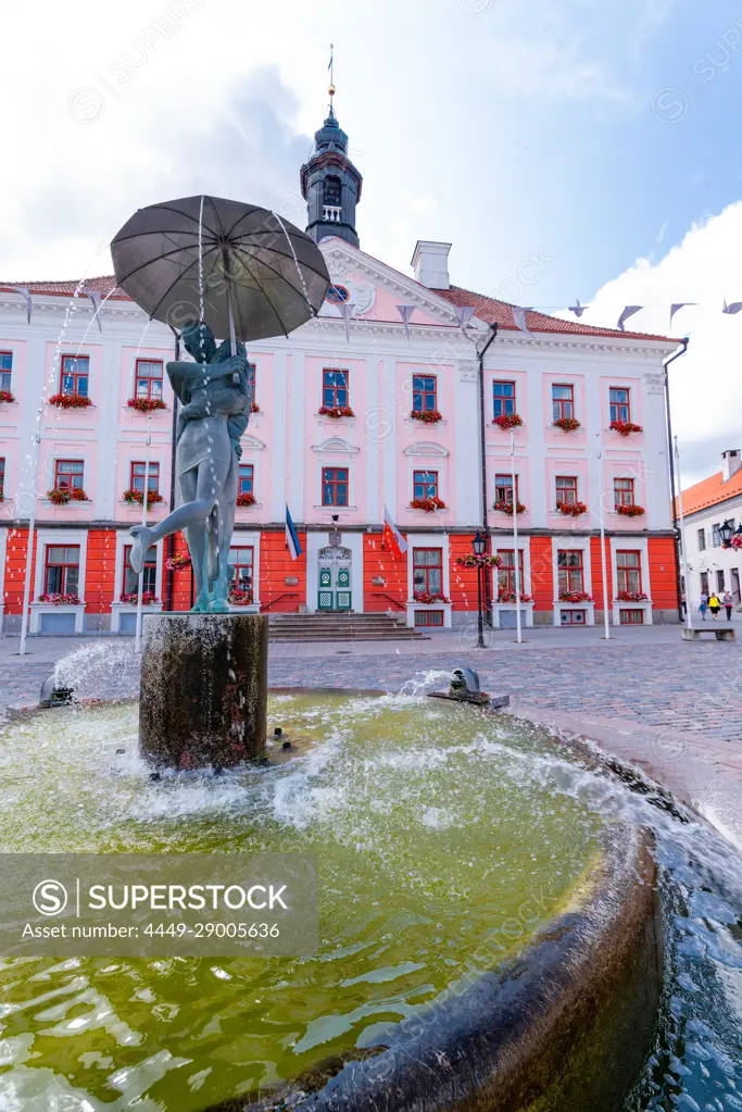 The town square of Tartu with the statue of the kissing students in a fountain, Estonia.