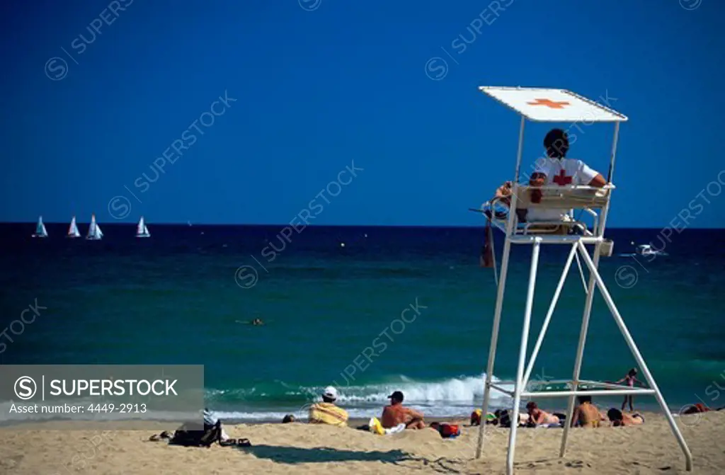 Lifeguards on the beach at Platja de la Barceloneta in Barcelona, Catalonia, Spain