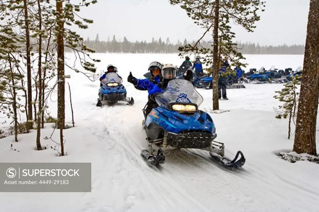Snowmobile tour through snowy landscape, Rovaniemi, Lapland, Finland, Europe