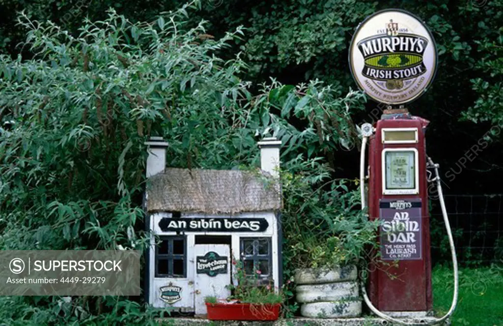 Europe, Great Britain, Ireland, Co. Kerry, old gas station with Murphy's beer sign on top near a pub in Lauragh on the Ring of Beara