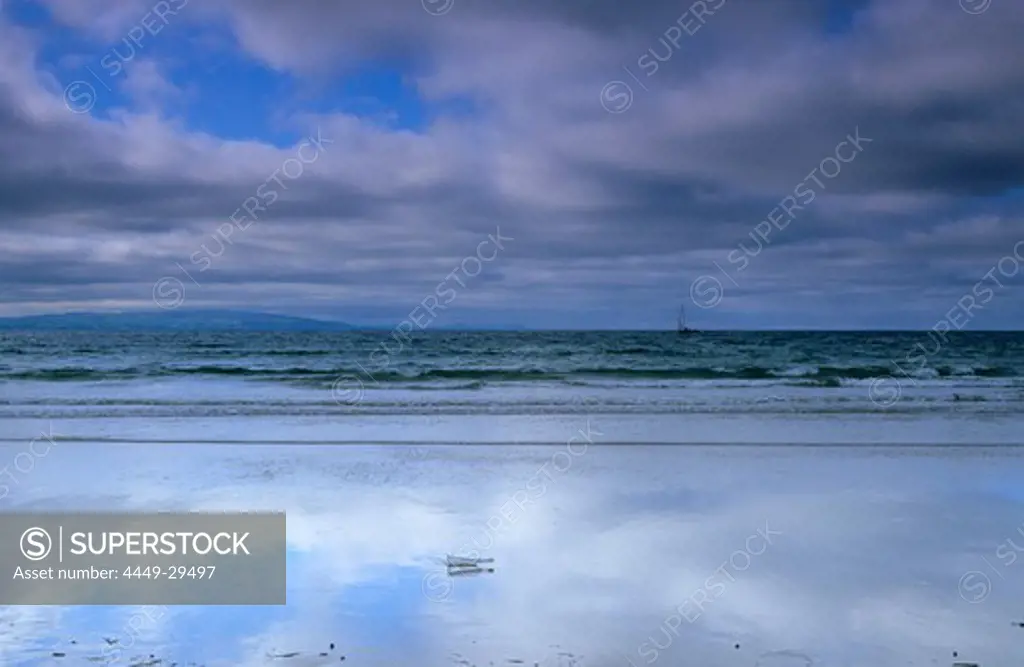 Message in a bottle on the beach under clouded sky, Portrush, County Antrim, Ireland, Europe