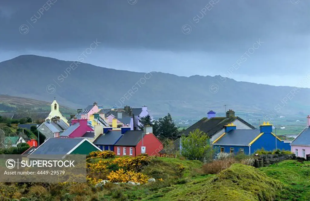 Colourful houses under grey clouds, Eyeries, Beara peninsula, County Cork, Ireland, Europe