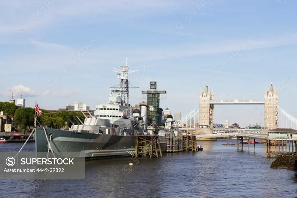 HMS Belfast on river Thames with Tower Bridge in background, London, London, England, United Kingdom