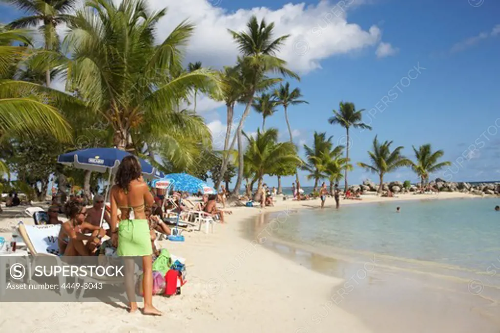 Girl selling clothes on Sainte-Anne Beach, Grande-Terre, Guadeloupe, Caribbean Sea, America