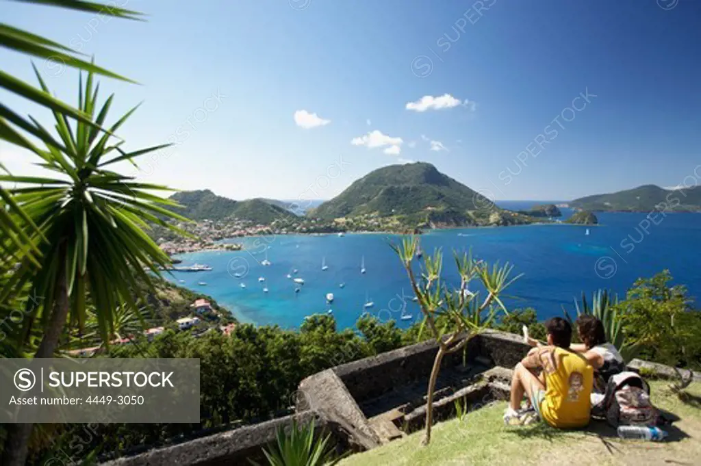 Panoramic view, Couple admiring the view, Fort Napoleon, Terre-de-Haute, Les Saintes Islands, Guadeloupe, Caribbean Sea, America