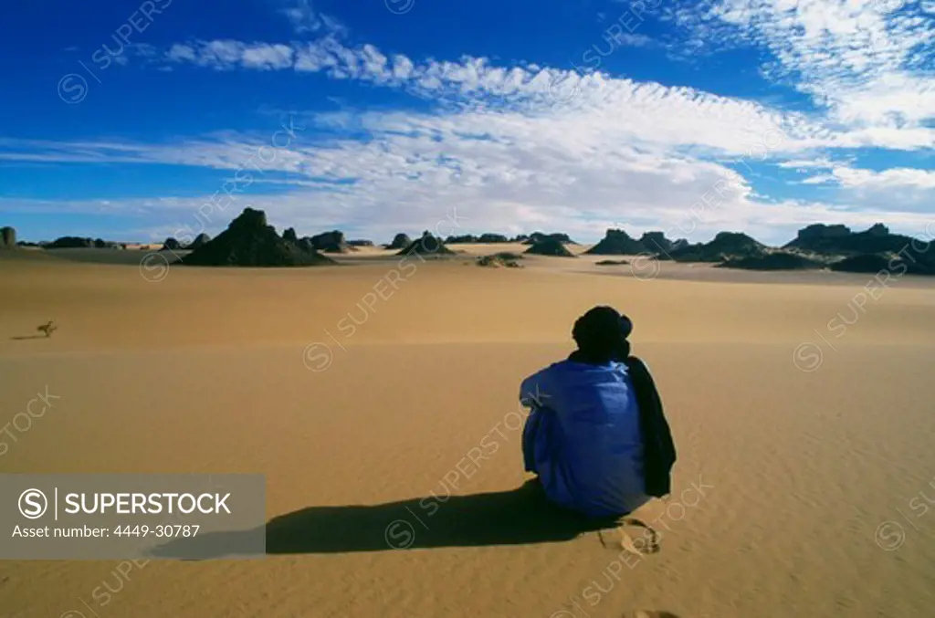 Berber People cowering in the sand, Tassili N' Ajjer, algerian Sahara, Algeria, Africa