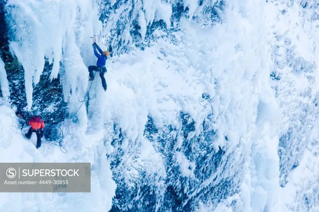 Ice climbing on icefall, Iceland