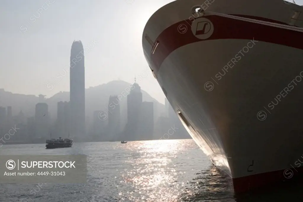 View at a ship's bow and the high rise buildings of Hong Kong Island, Hong Kong, China, Asia