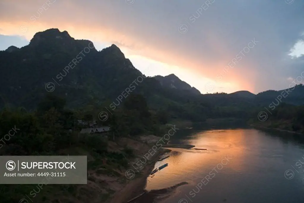 The river Nam Ou at Nong Kiao Village at dusk, Luang Prabang province, Laos