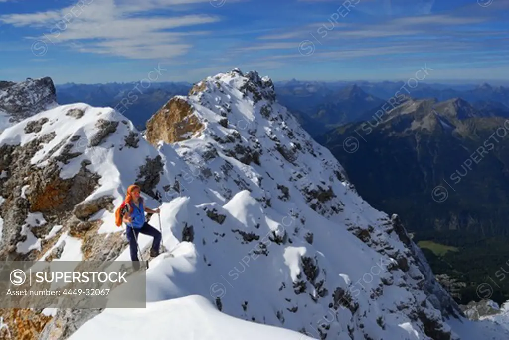 Woman on ridge to summit of Zugspitze, Wetterstein range, Upper Bavaria, Bavaria, Germany
