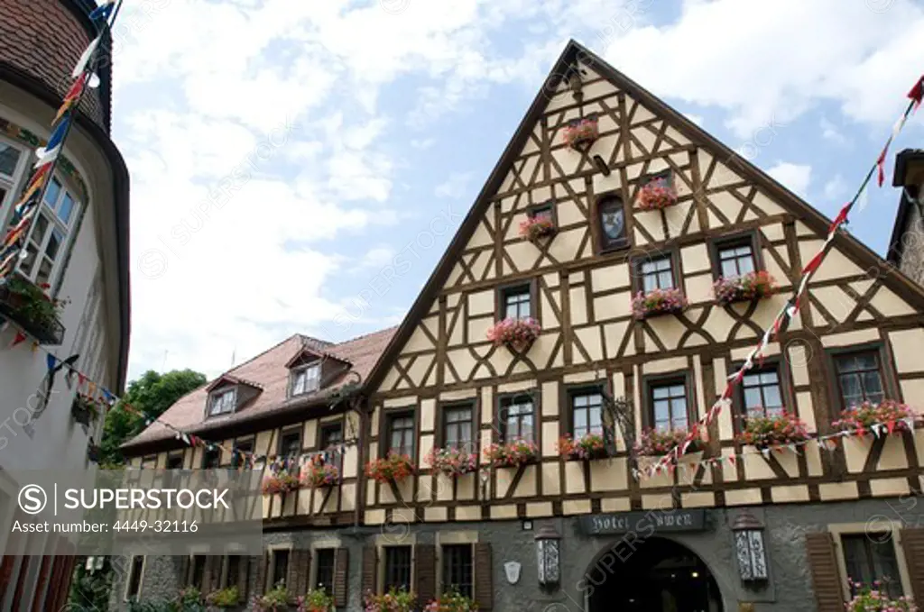 Exterior view of the Hotel and Restaurant Loewen under cloudy sky, Marktbreit, Franconia, Bavaria, Germany