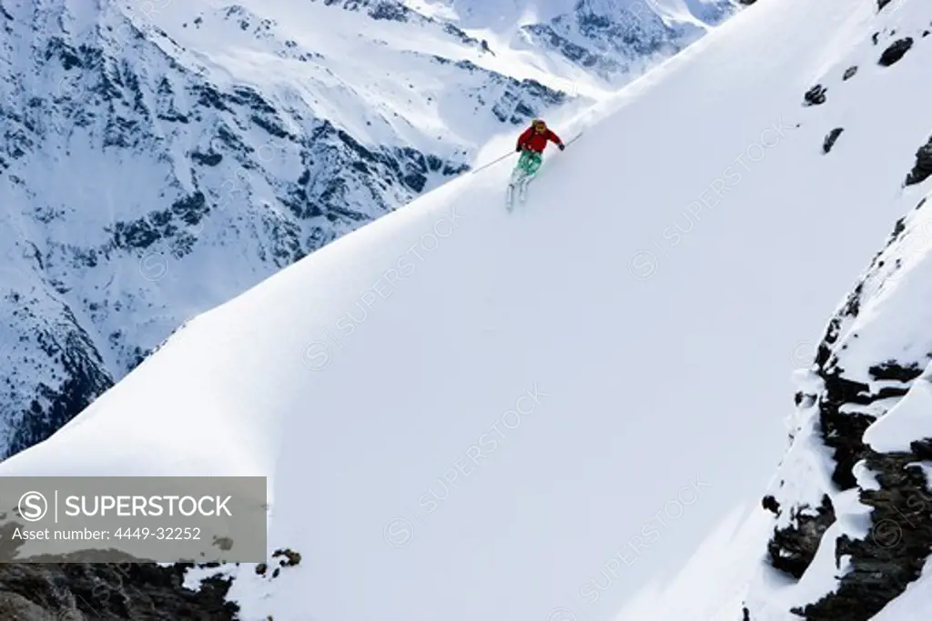 Domaine de Freeride, Zinal, A young man skiing in powder snow, canton Valais, Wallis, Switzerland, Alps, MR