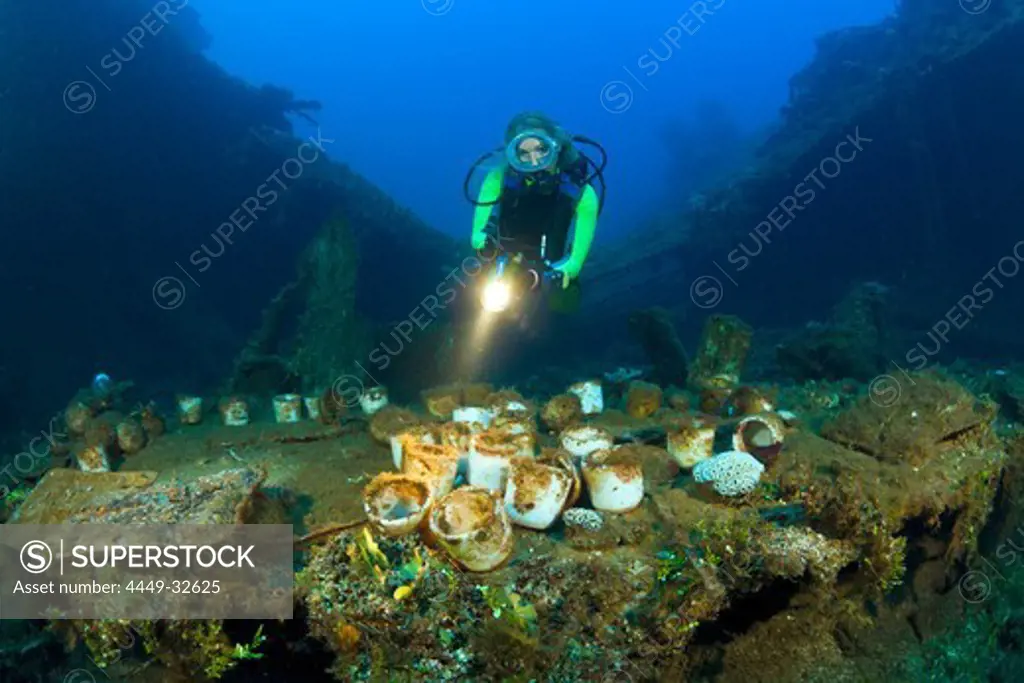 Diver discover Tableware and Artifacts on USS Saratoga, Marshall Islands, Bikini Atoll, Micronesia, Pacific Ocean